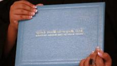 Closeup of student holding diploma